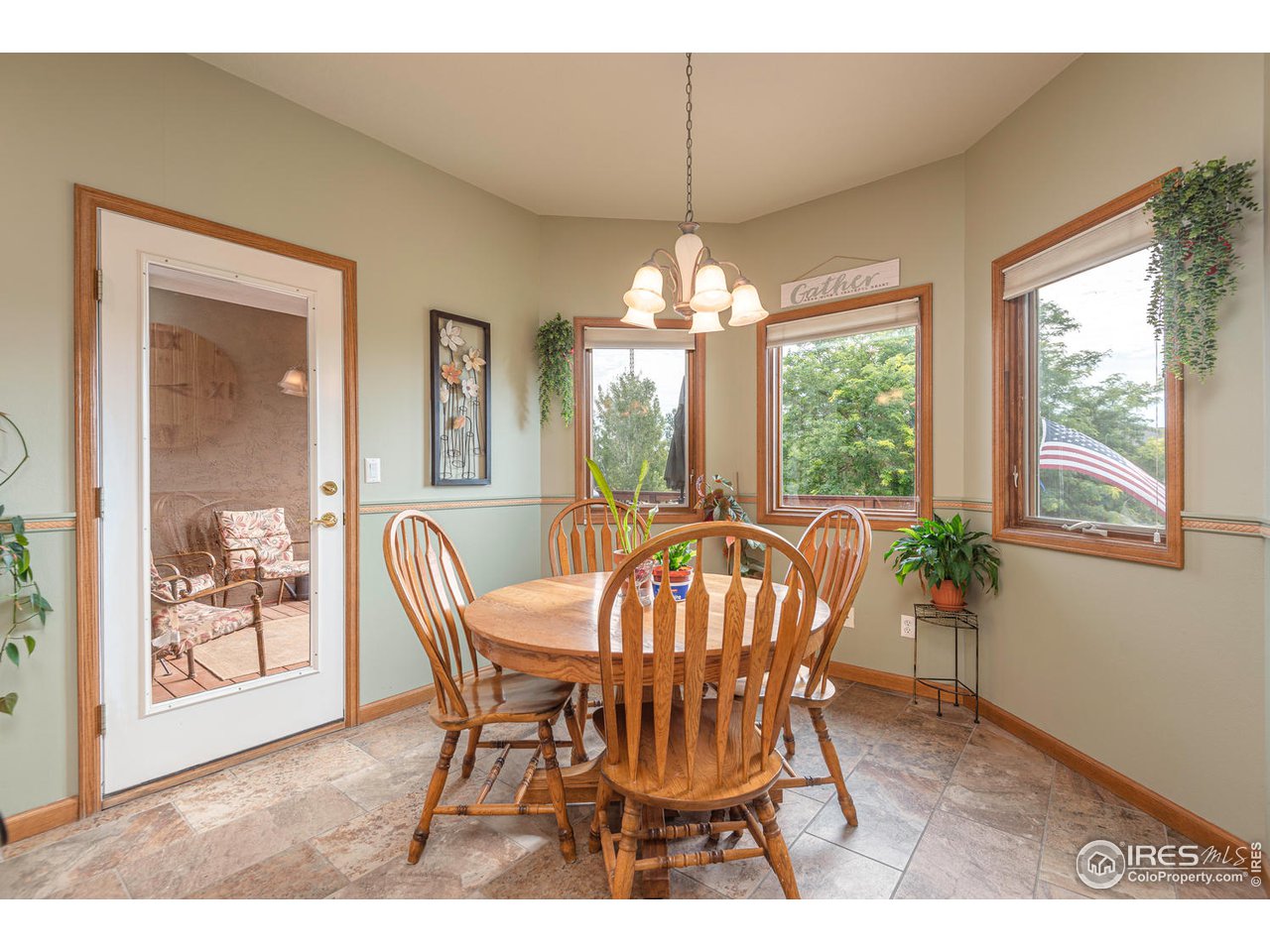 6443 Ashcroft Road Greeley, CO 80634 - Photo 11 of 37 Breakfast/Eating area to Deck