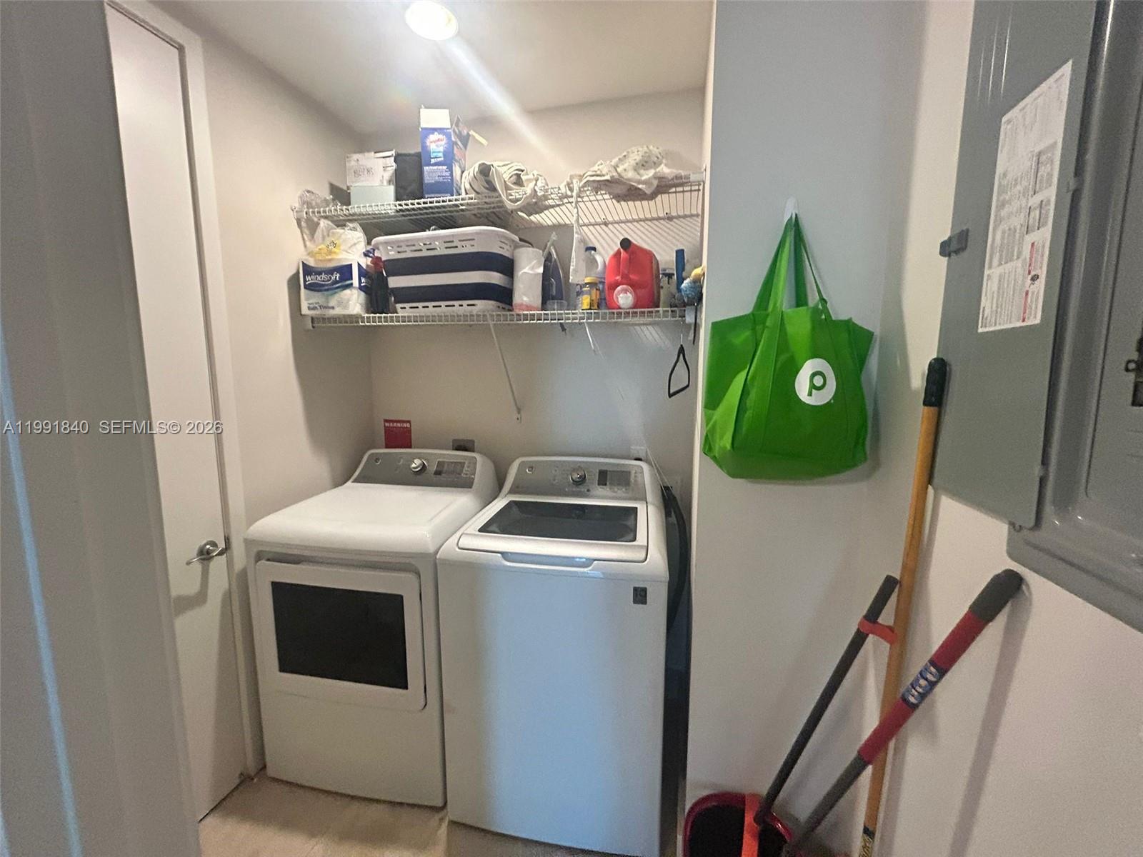 218 Southeast 14th Street, Unit TS303 Miami, FL 33131 - Photo 15 of 16 a utility room with dryer and washer
