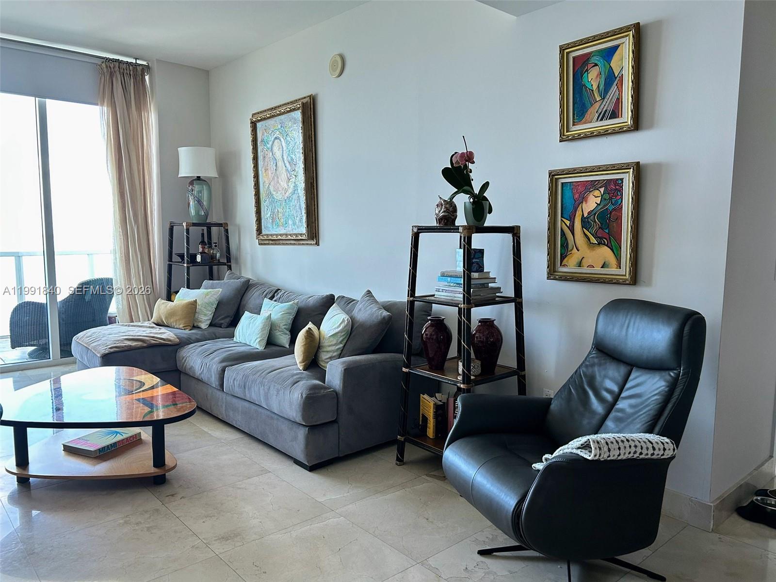 218 Southeast 14th Street, Unit TS303 Miami, FL 33131 - Photo 3 of 16 a living room with furniture