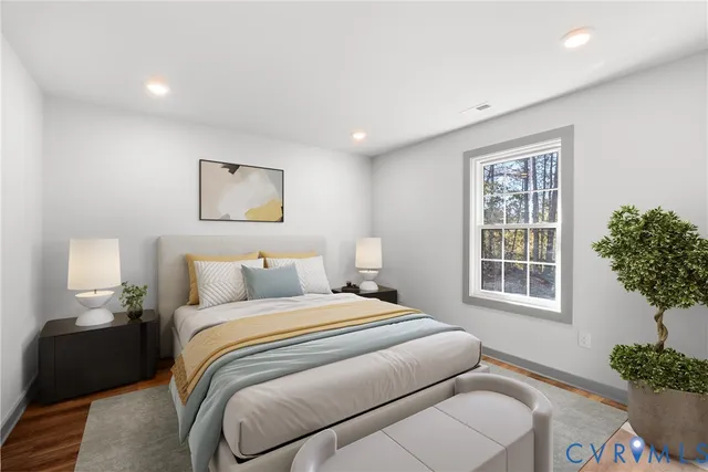 a bedroom with bed and a window