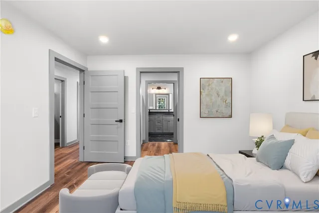 a bedroom with a bed and a couch