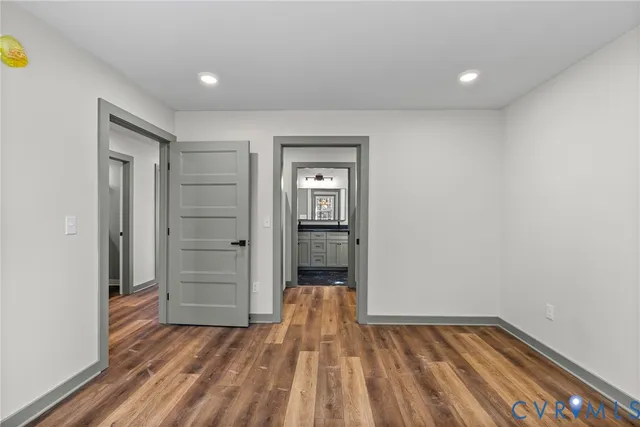 a view of hallway with wooden floor