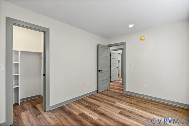 a view of a livingroom with wooden floor and closet
