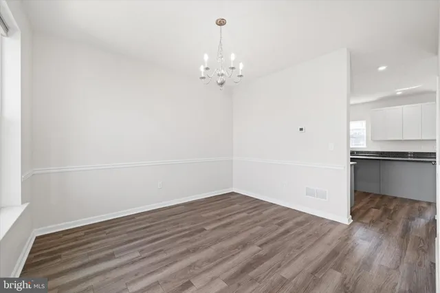 a bedroom with a large bed and window