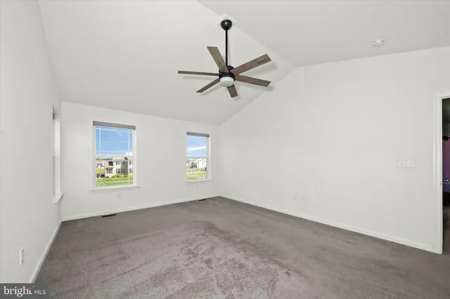 a spacious bathroom with a tub and mirror