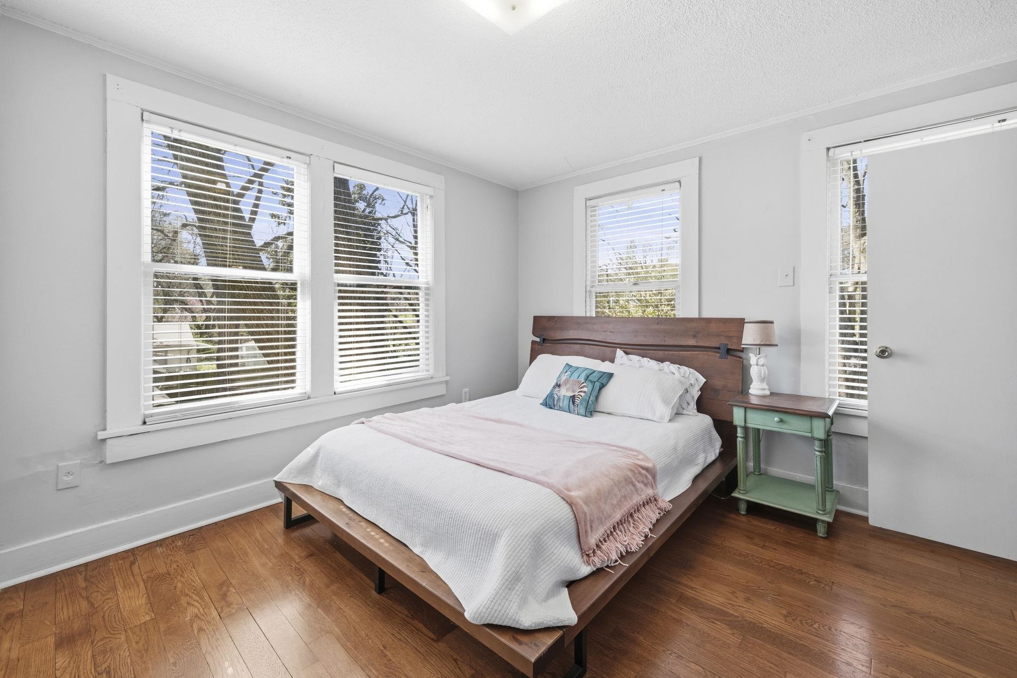 471 South Reese Street Memphis, TN 38111 - Photo 14 of 22 a large bed sitting in a bedroom next to a window