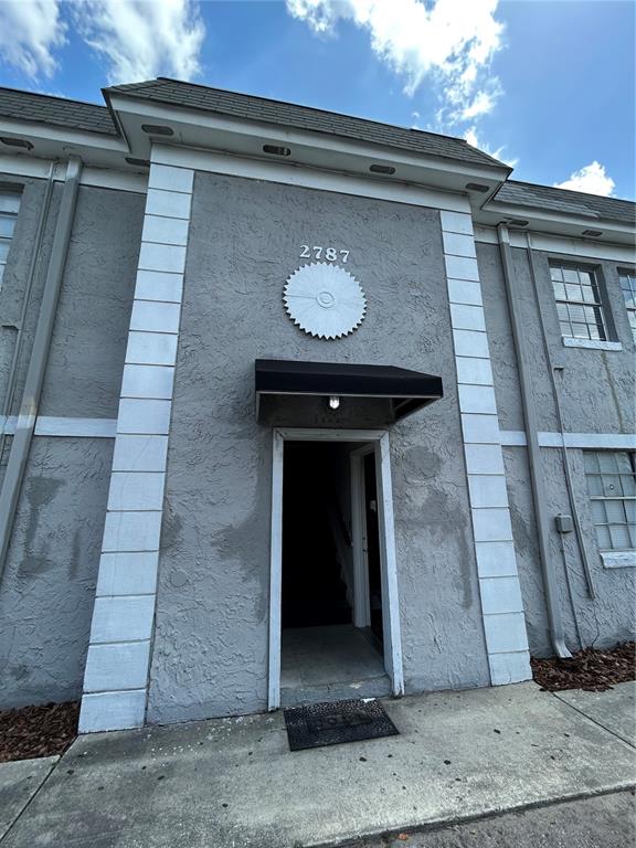 2787 L B McLeod Road, Unit D Orlando, FL 32805 - Photo 1 of 9 a building with a door and a window