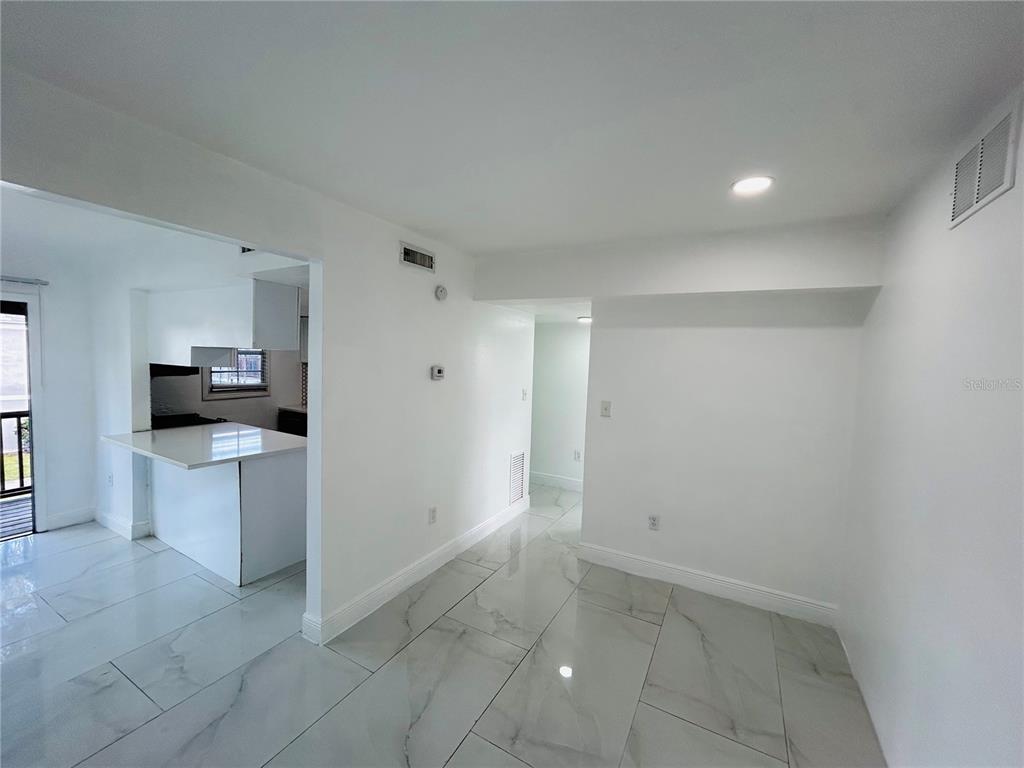 2787 L B McLeod Road, Unit D Orlando, FL 32805 - Photo 4 of 9 a view of kitchen with refrigerator sink and stove