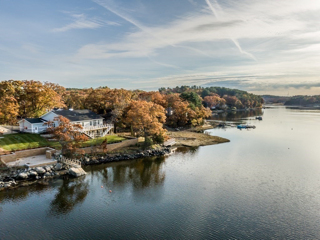 an aerial view of residential building with lake view