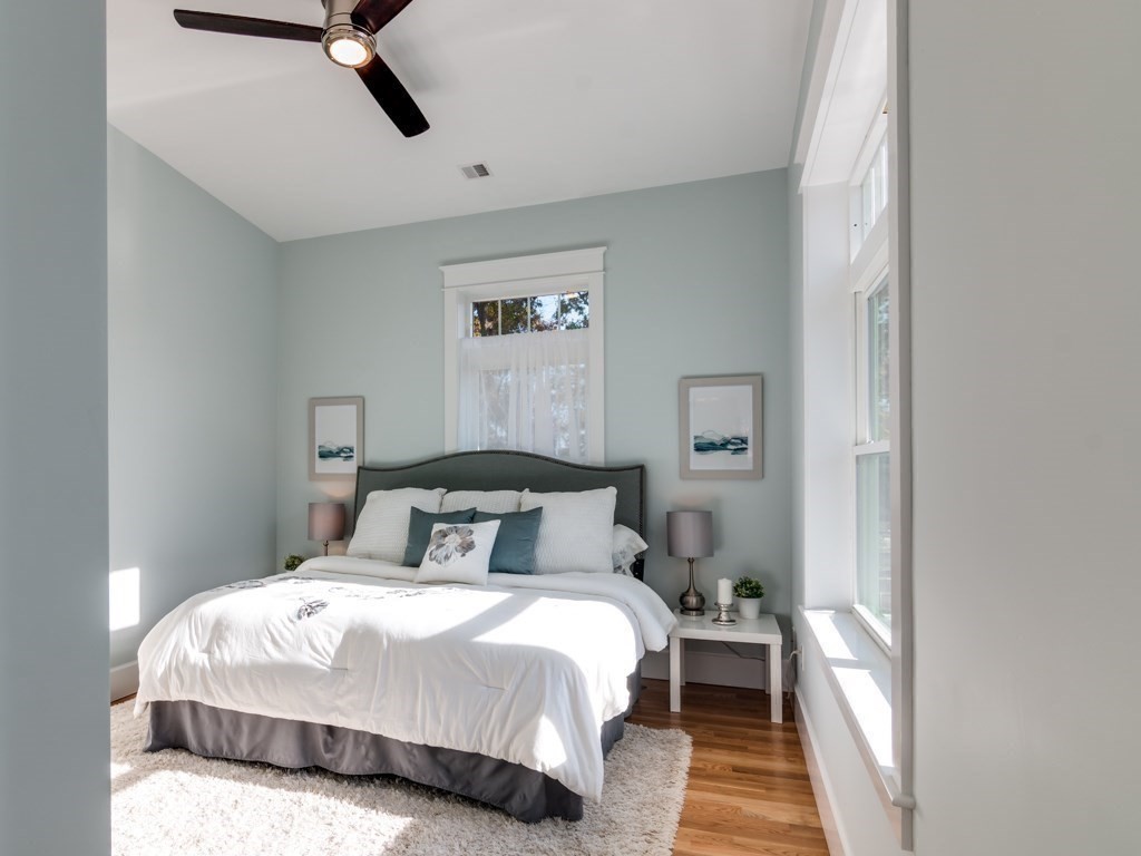 8 Stanwood Point, Unit A Gloucester, MA 01930 - Photo 11 of 21 a bedroom with a bed and a mirror