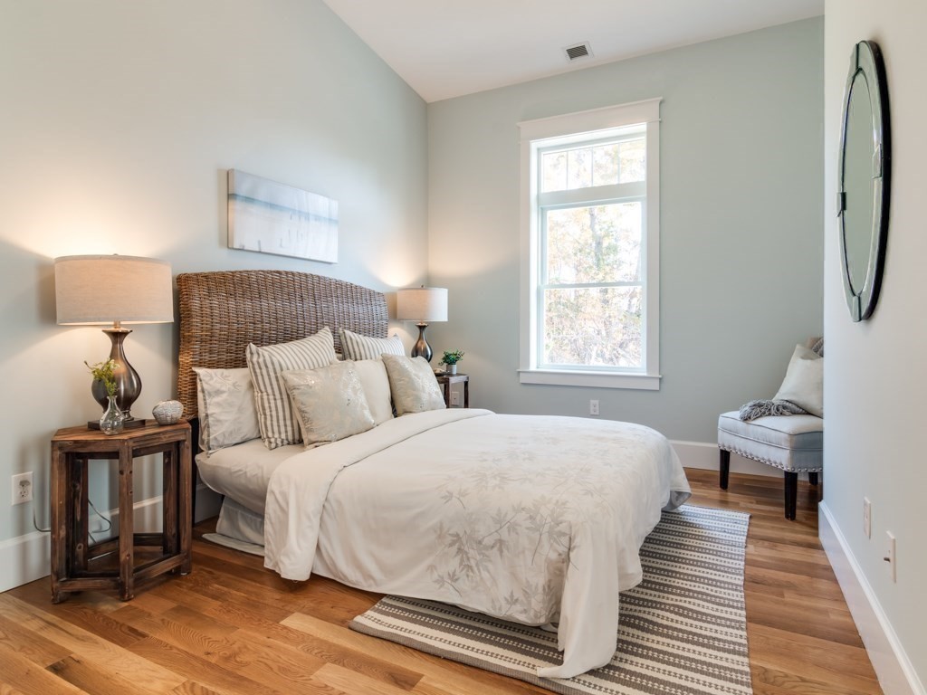 8 Stanwood Point, Unit A Gloucester, MA 01930 - Photo 12 of 21 a bedroom with a bed and wooden floor
