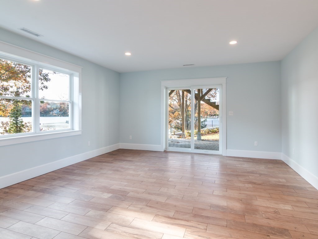8 Stanwood Point, Unit A Gloucester, MA 01930 - Photo 13 of 21 wooden floor in an empty room with a window