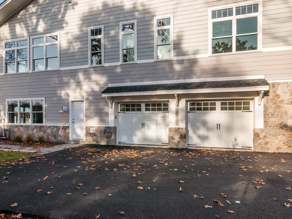 8 Stanwood Point, Unit A Gloucester, MA 01930 - Photo 16 of 21 a front view of a house with a yard