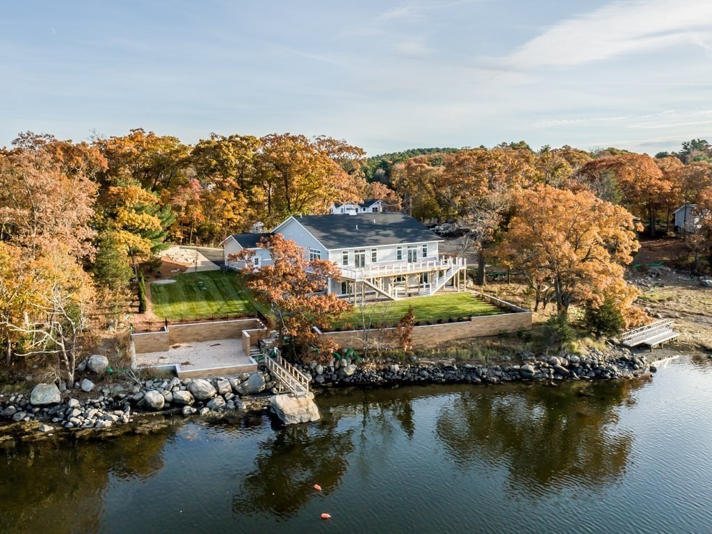 8 Stanwood Point, Unit A Gloucester, MA 01930 - Photo 2 of 21 a view of a lake with houses