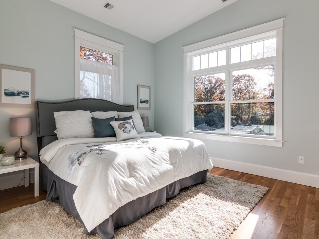 8 Stanwood Point, Unit A Gloucester, MA 01930 - Photo 10 of 21 a bedroom with a bed and a window