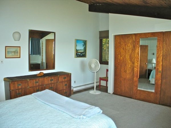 291 Barnes Road Oak Bluffs, MA 02557 - Photo 12 of 30 a bedroom with a bed and a dresser