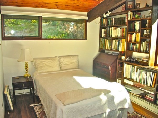 291 Barnes Road Oak Bluffs, MA 02557 - Photo 13 of 30 a bedroom with a bed and wooden floor