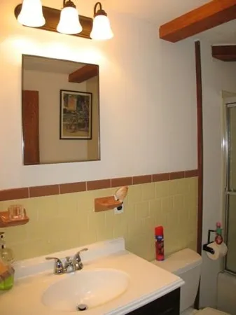 a bathroom with a sink and a mirror