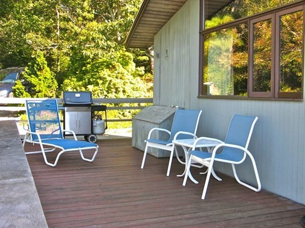 291 Barnes Road Oak Bluffs, MA 02557 - Photo 24 of 30 a view of a dining room with furniture a chandelier and wooden floor