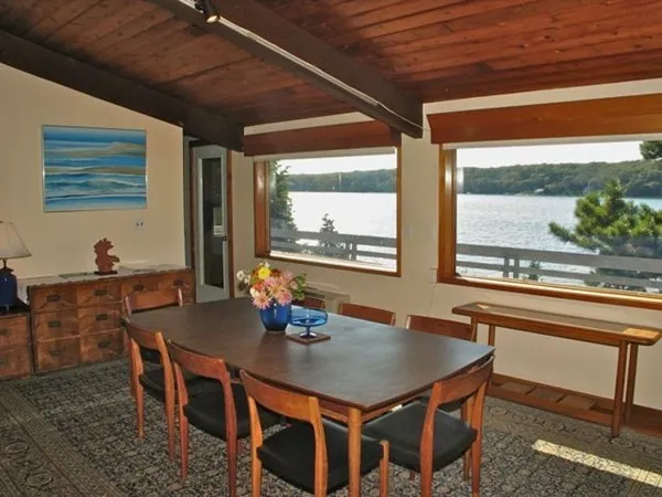 a view of a dining room with furniture window and outside view