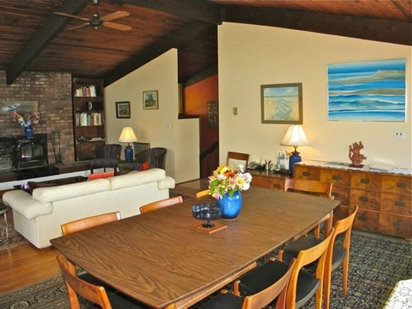 291 Barnes Road Oak Bluffs, MA 02557 - Photo 8 of 30 a view of a dining room with furniture and a chandelier