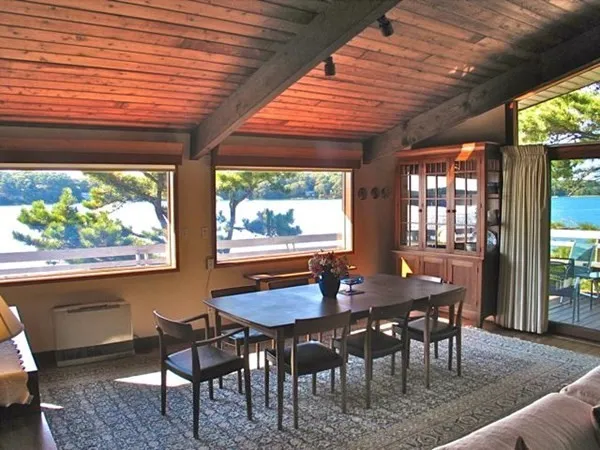 a view of a dining room with furniture window and outside view