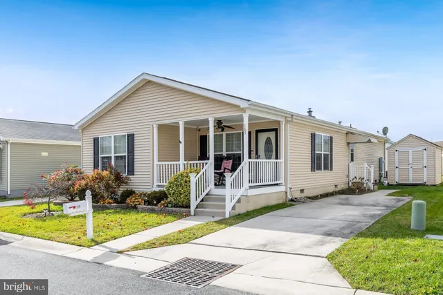 a front view of house with yard outdoor seating and barbeque oven