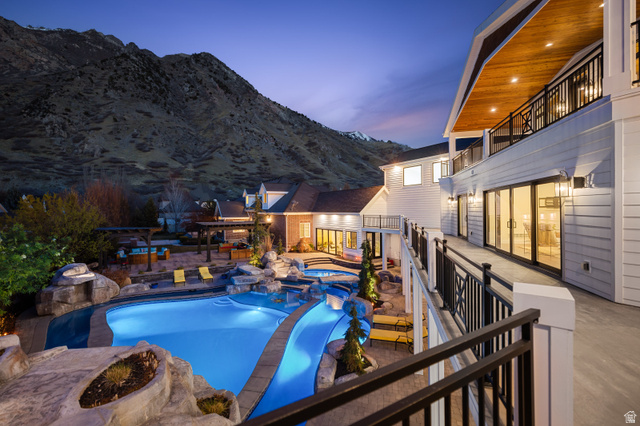 1263 Chapman Court Alpine, UT 84004 - Photo 4 of 83 Integrated pool / spa with a mountain view, a patio area, and a balcony
