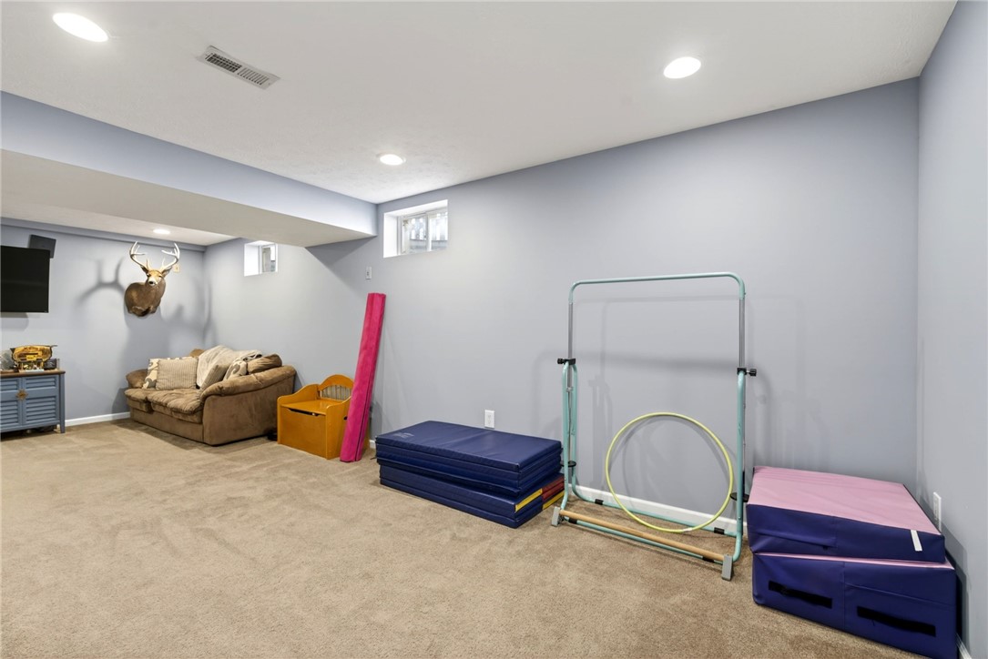39 Holly Court Springboro, OH 45066 - Photo 27 of 42 This versatile basement space offers an ideal setting for relaxation and recreation.