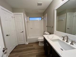 720 Fox Run Trail Saginaw, TX 76179 - Photo 15 of 17 a bathroom with a double vanity sink toilet and shower