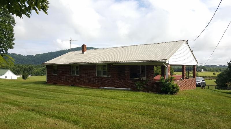 2713 Beech Mountain Road Ferrum, VA 24088 - Photo 3 of 24 a front view of house with garden