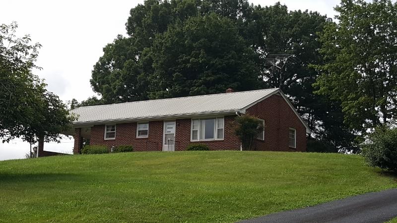 2713 Beech Mountain Road Ferrum, VA 24088 - Photo 22 of 24 a view of a house with a yard