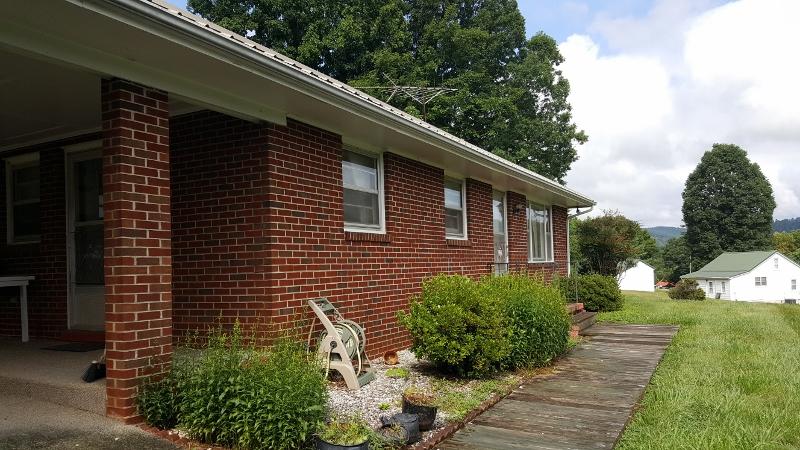 2713 Beech Mountain Road Ferrum, VA 24088 - Photo 23 of 24 a backyard of a house with lots of green space