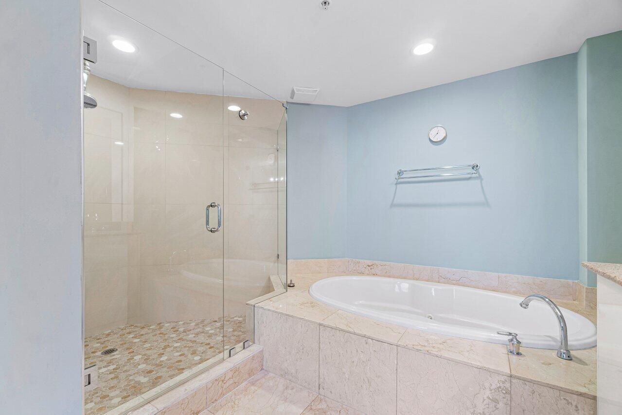 191 Southeast 20th Avenue, Unit 513 Deerfield Beach, FL 33441 - Photo 17 of 34 a bathroom with a bathtub and a shower