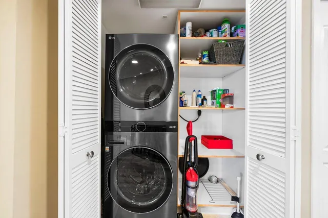 a view of a balcony with wooden floor and outdoor seating