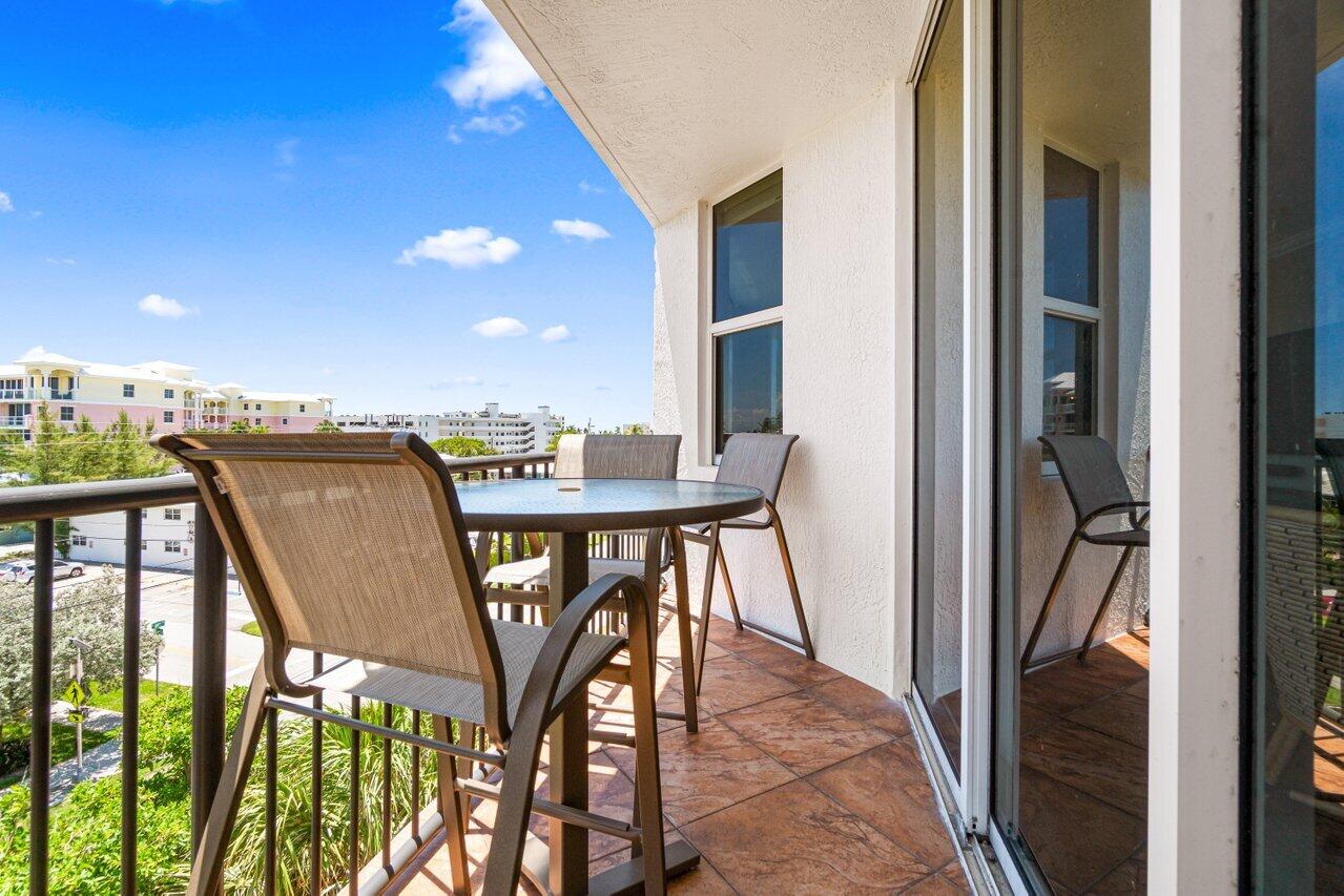 191 Southeast 20th Avenue, Unit 513 Deerfield Beach, FL 33441 - Photo 24 of 34 a view of a balcony with furniture