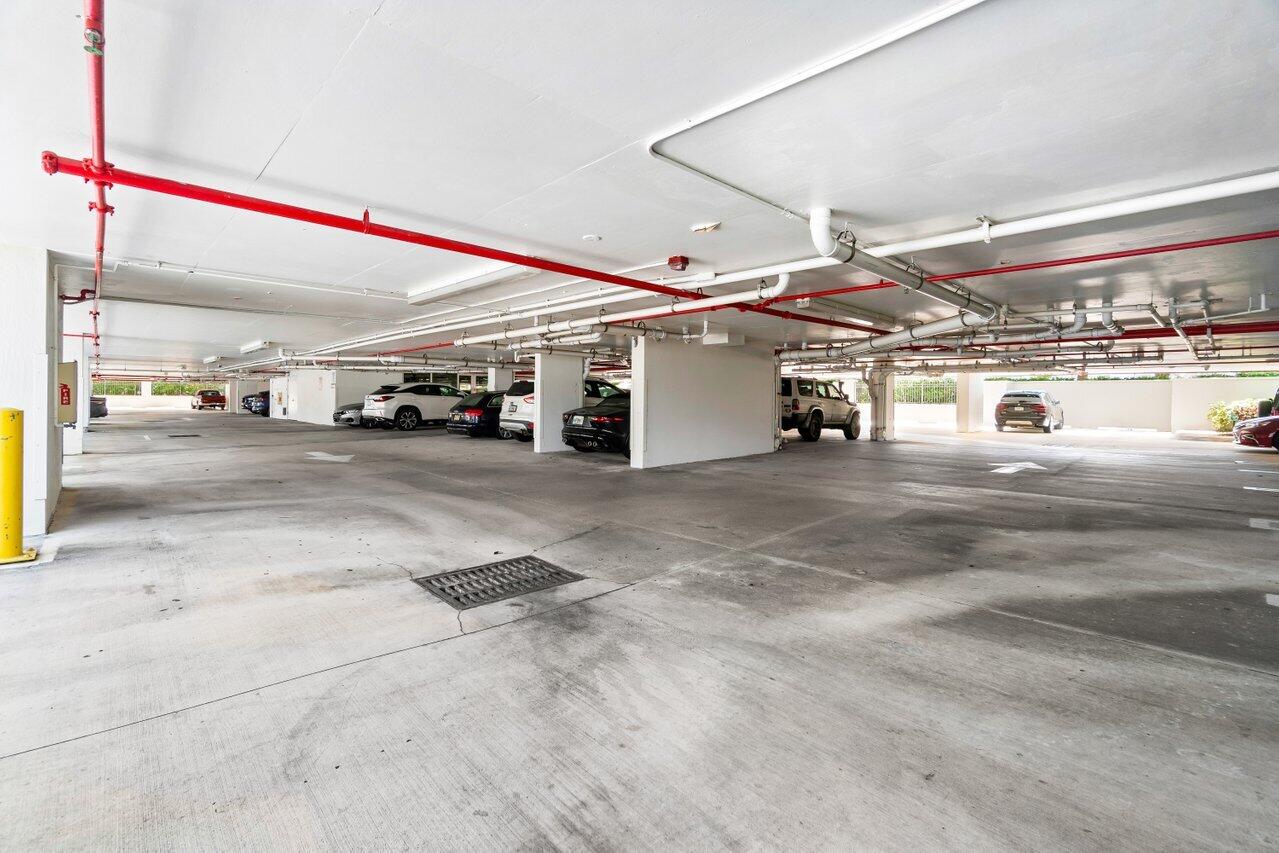 191 Southeast 20th Avenue, Unit 513 Deerfield Beach, FL 33441 - Photo 28 of 34 a view of a parking area