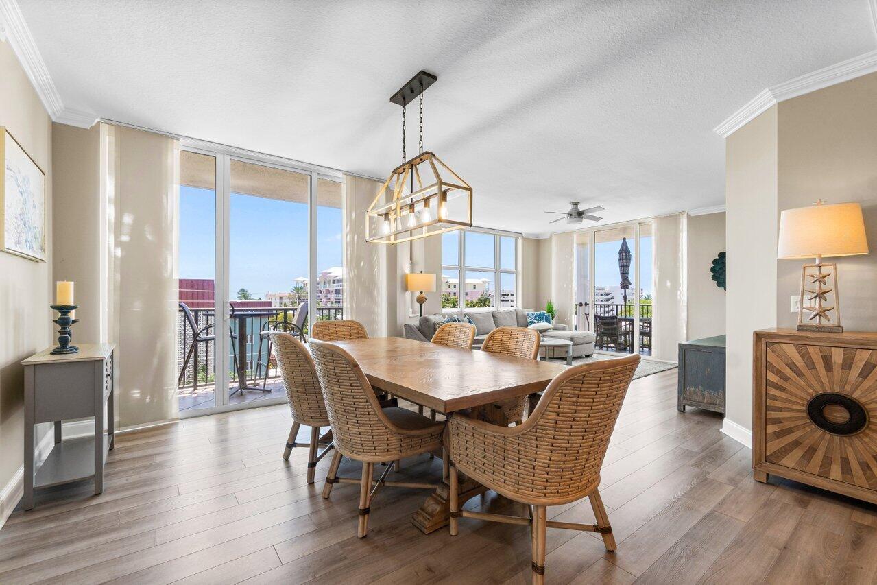191 Southeast 20th Avenue, Unit 513 Deerfield Beach, FL 33441 - Photo 9 of 34 a view of a a dining room with furniture window and wooden floor