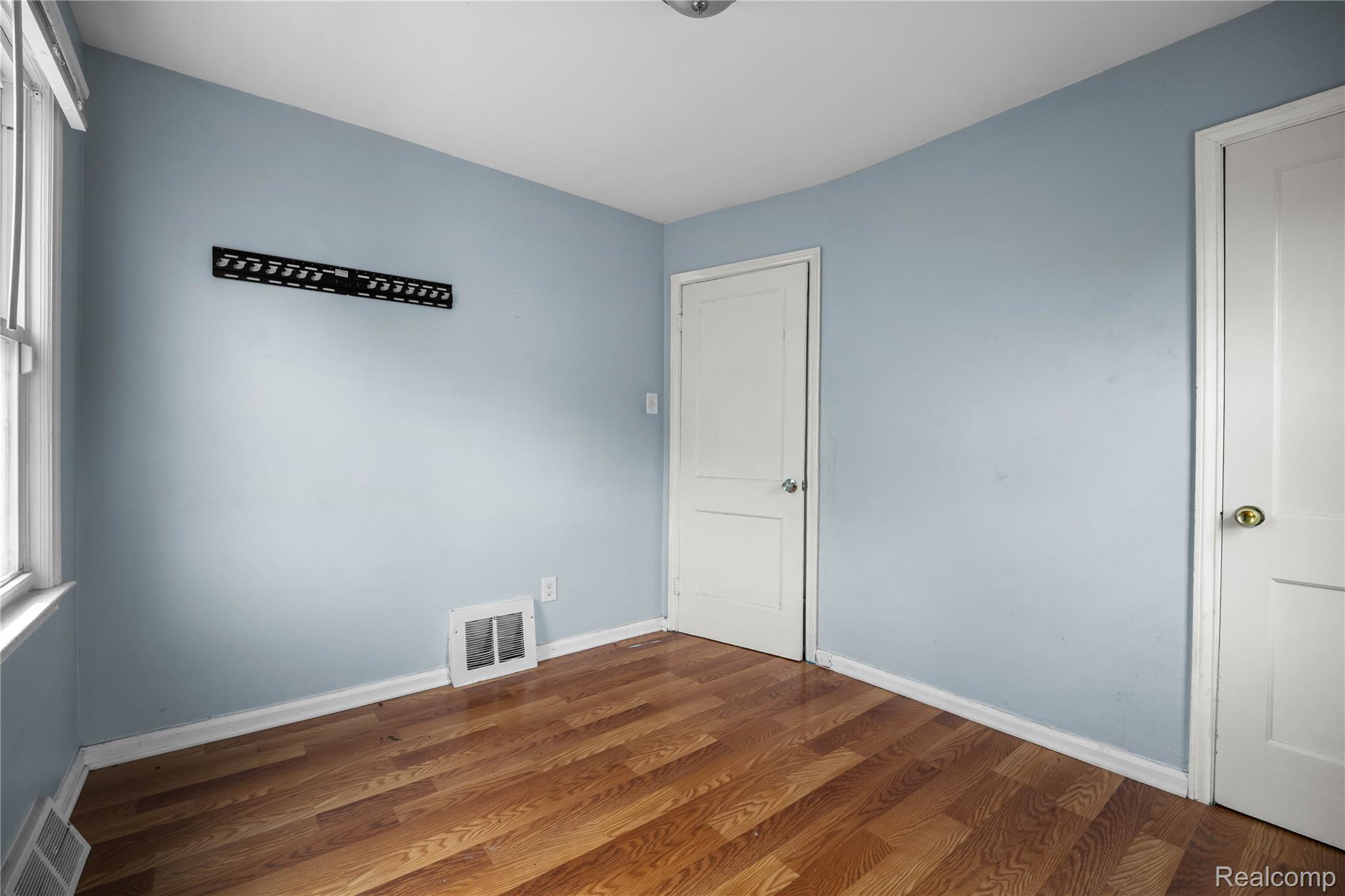 4049 Williams Street Inkster, MI 48141 - Photo 9 of 21 Spare room with dark wood finished floors and baseboards