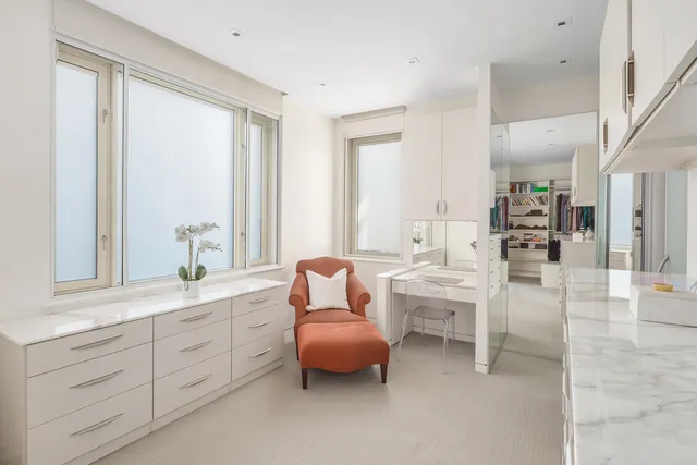 a bedroom with bed and window