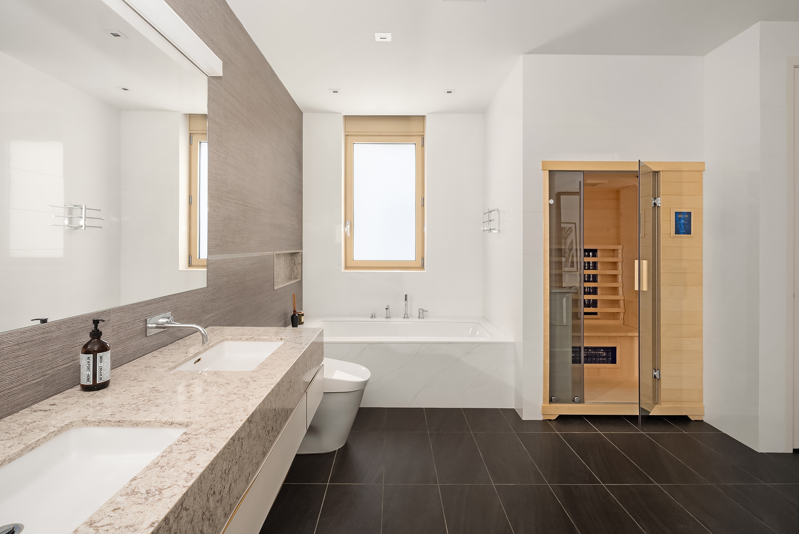 21 East 96th Street, Unit 3/4 Manhattan, NY 10128 - Photo 13 of 25 a bathroom with a granite countertop sink and a bathtub