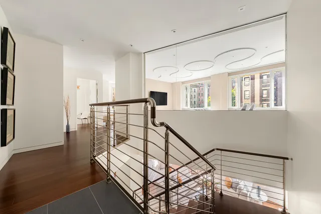 a bathroom with a granite countertop sink and a bathtub