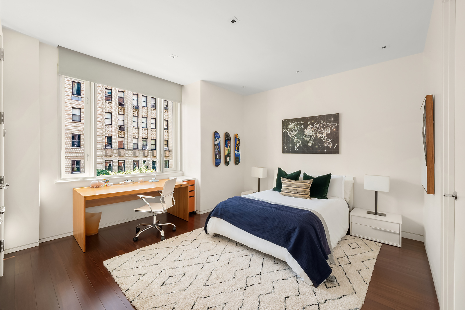 21 East 96th Street, Unit 3/4 Manhattan, NY 10128 - Photo 21 of 25 a bedroom with a bed and a desk