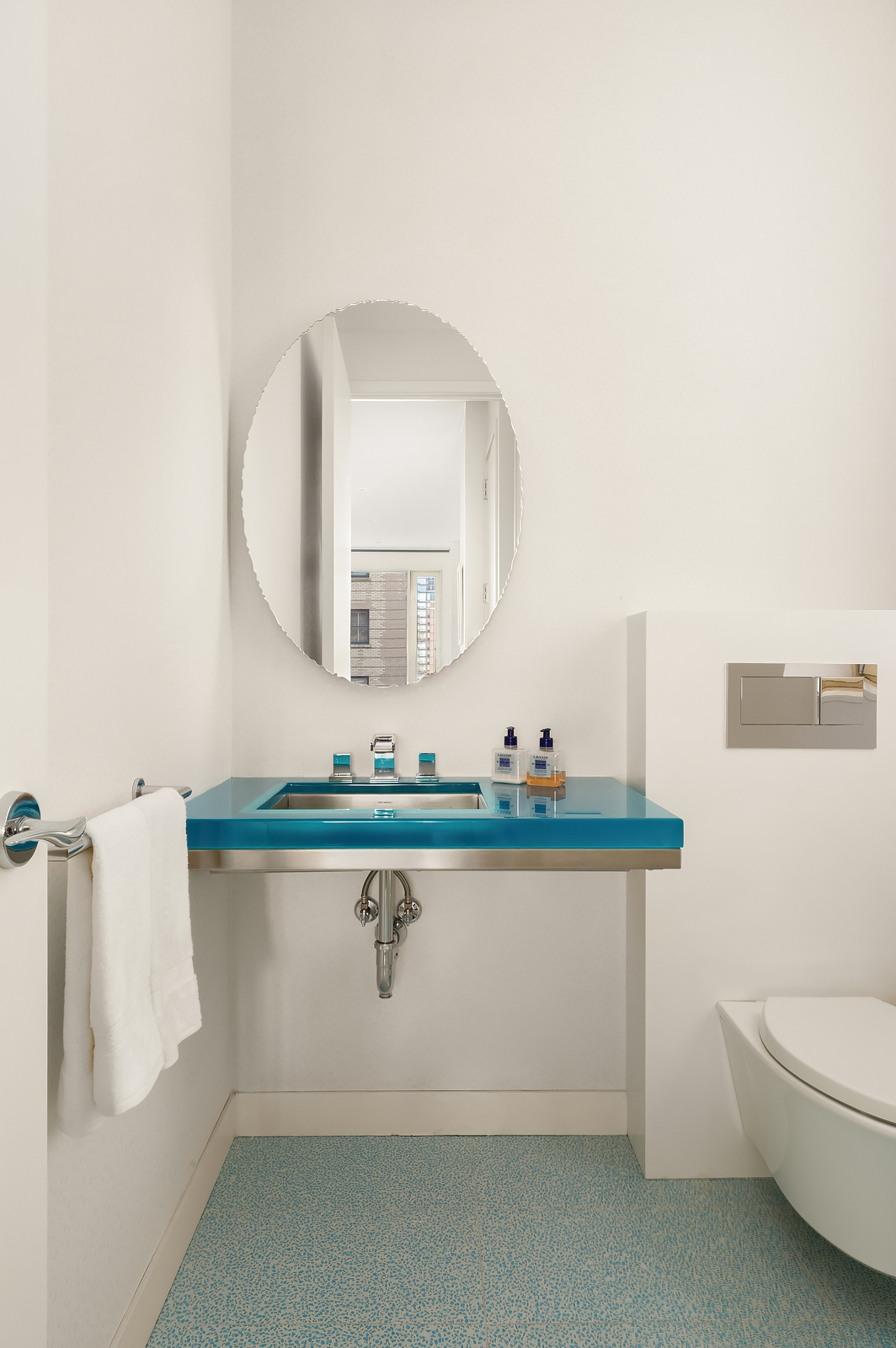 21 East 96th Street, Unit 3/4 Manhattan, NY 10128 - Photo 24 of 25 a bathroom with a toilet sink and mirror