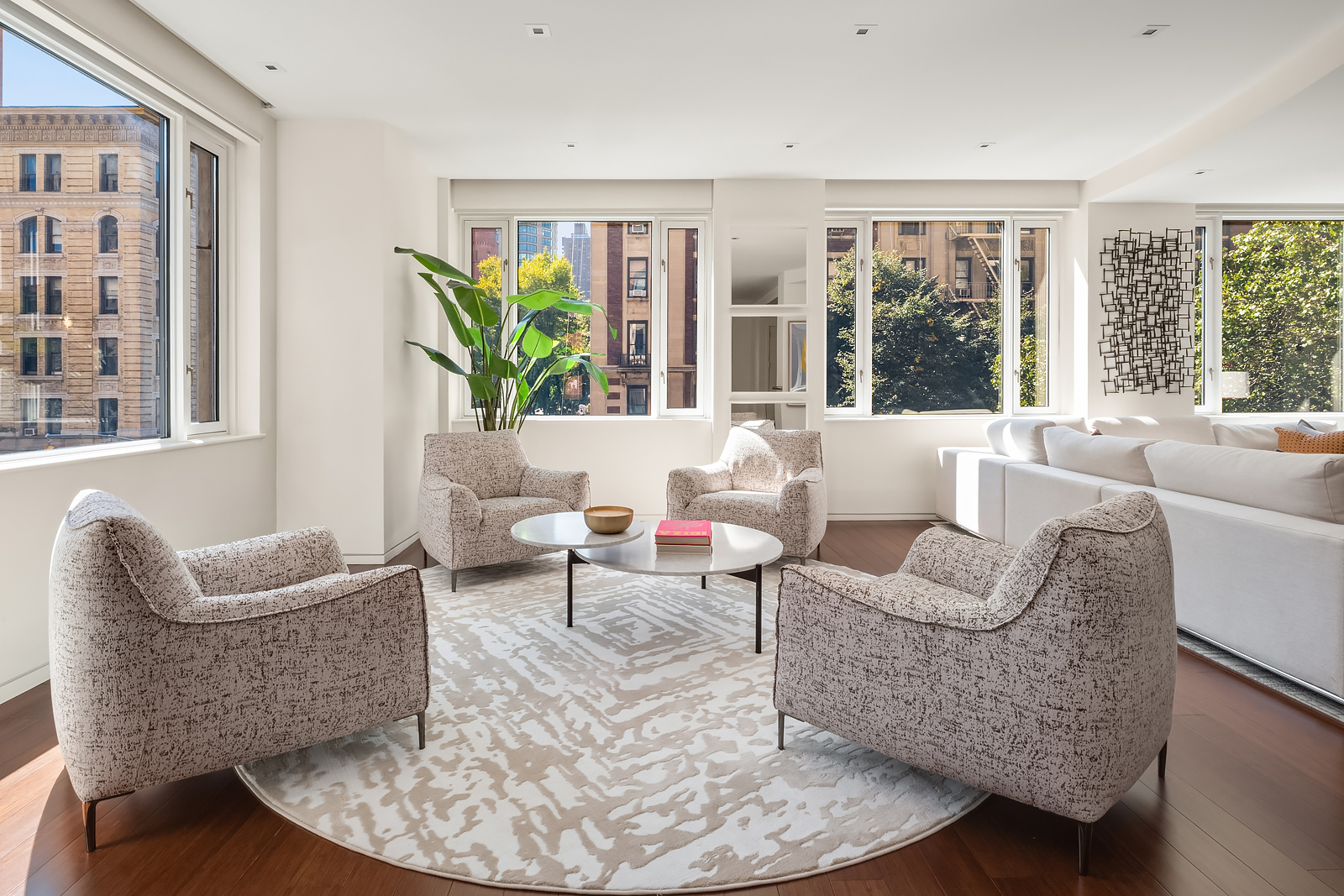 21 East 96th Street, Unit 3/4 Manhattan, NY 10128 - Photo 3 of 25 a living room with furniture and a potted plant
