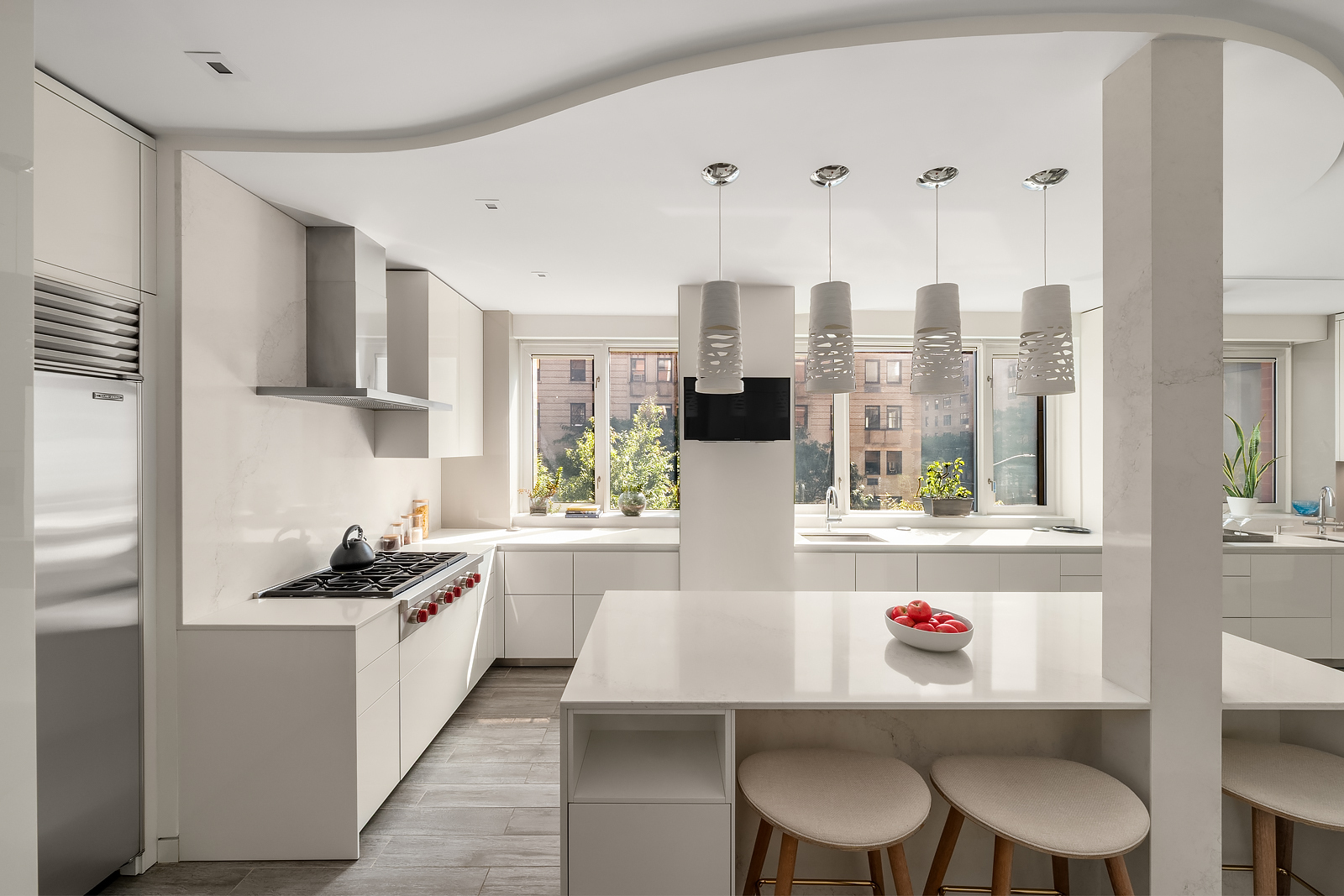 21 East 96th Street, Unit 3/4 Manhattan, NY 10128 - Photo 8 of 25 a kitchen with stainless steel appliances granite countertop a stove a sink dishwasher and a refrigerator with wooden floor