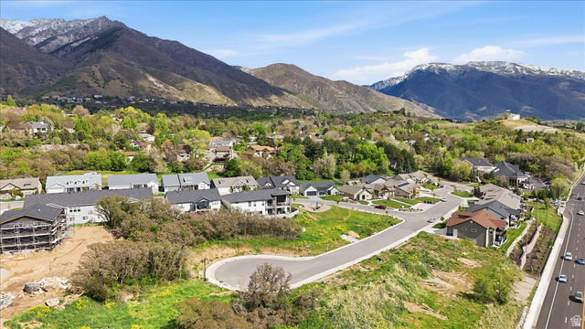 5102 Sunset Way, Unit 404 Ogden, UT 84403 - Photo 6 of 13 Aerial perspective of suburban area with a mountainous background