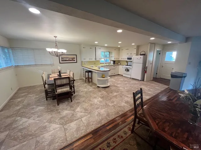 a kitchen with sink refrigerator and microwave