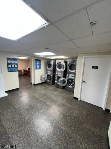 a view of a livingroom with furniture and a window