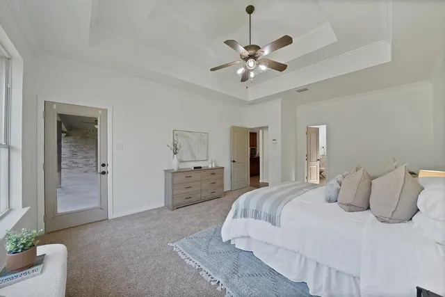 a bedroom with furniture and a chandelier